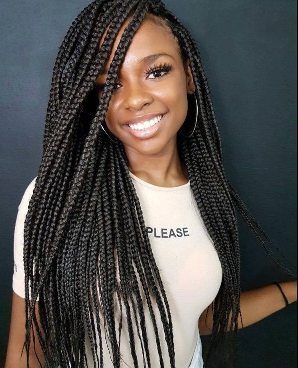 woman black hair long braids sexy